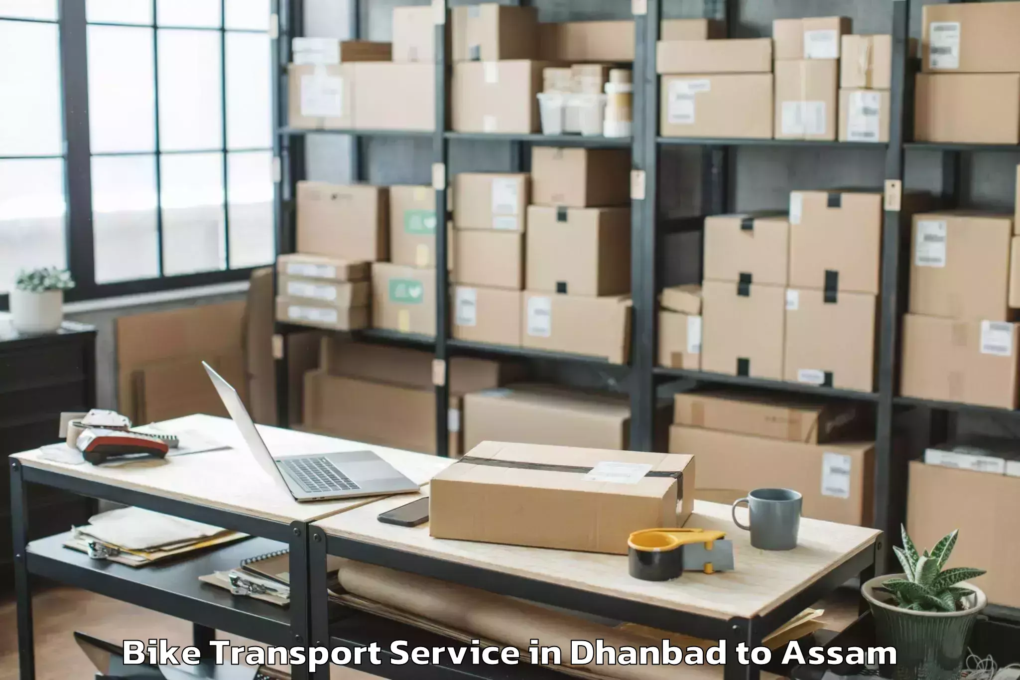 Professional Dhanbad to Bokajan Bike Transport